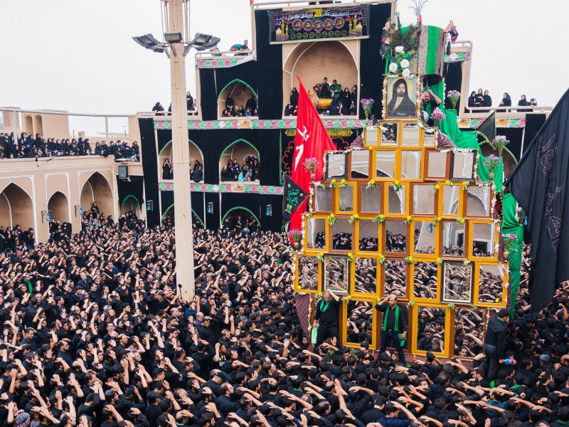 muharam mourning, Ashura Day, Nakhl Gardani , people wearing black clothing and singing, Yazd, Iran