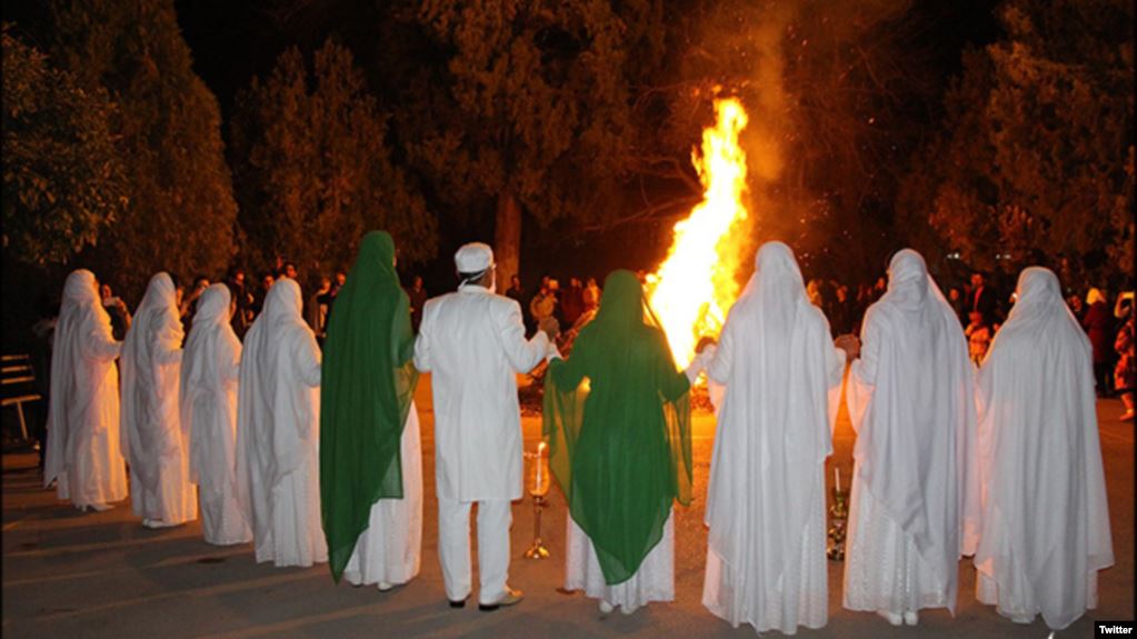 A Zoroastrians ceremony, gathering around fire and praying together, Iran