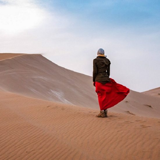 a girl standing in desert, Iran desert