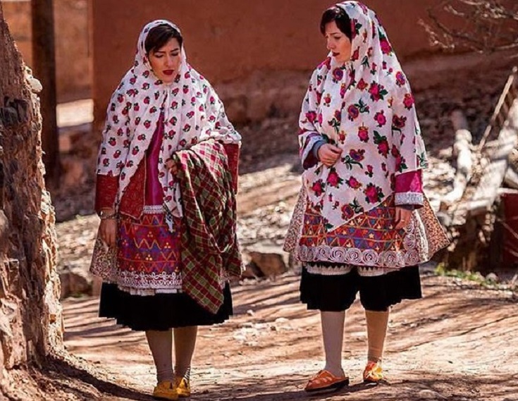 two women wearing traditional clothes in Abyane village
