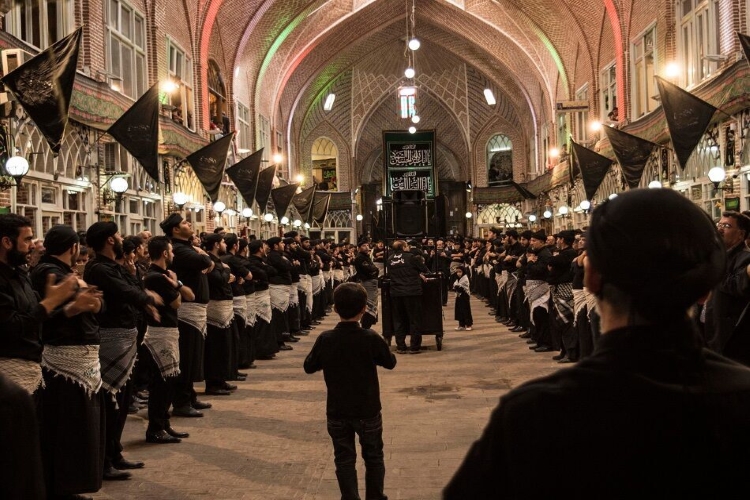 people wearing black clothes in religious ceremony in Tabriz Bazaar