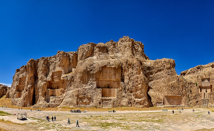 a wide view of Naqsh-e Rostam, the ancient necropolis (elaborate cemetery) cut into the high cliff, Things to Do in Shiraz