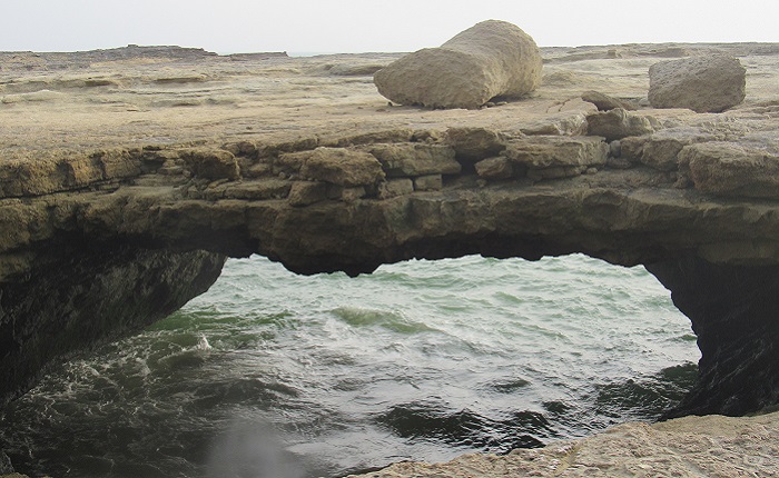 A view of rocks and sea in Pozm Tiyab Port, Chabahar, Iran 
