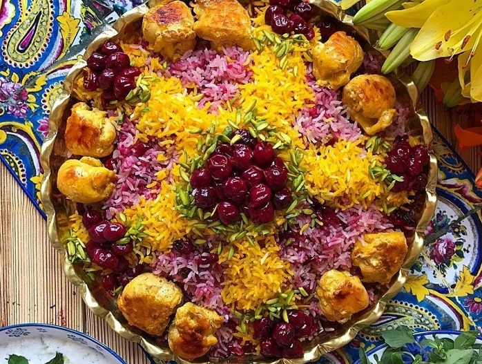 Albaloo polo, cooked by using sour cherries, rice, and meat, Persian food