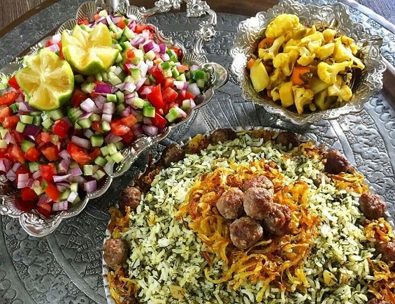 Kalam Polo, Persian dish, served with pickles and Shirazi Salad